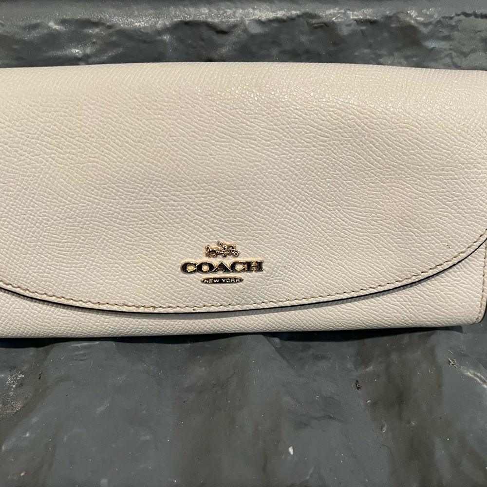 Coach wallet great condition. 3 small pen marks inside wallet.